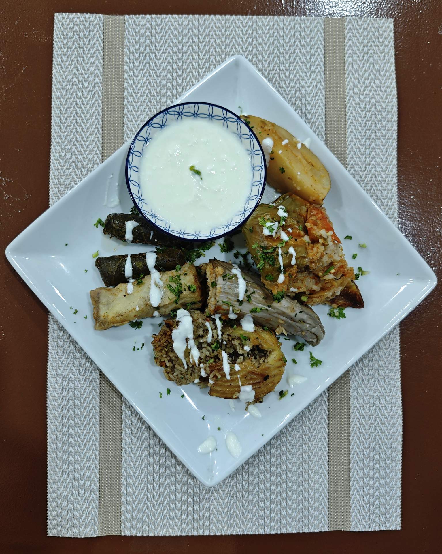 A platter of dolma with a yogurt salad
